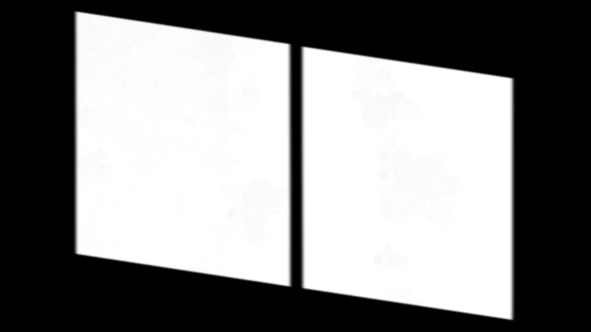 Two transparent sheets with printed data tables overlapping on a desk.
